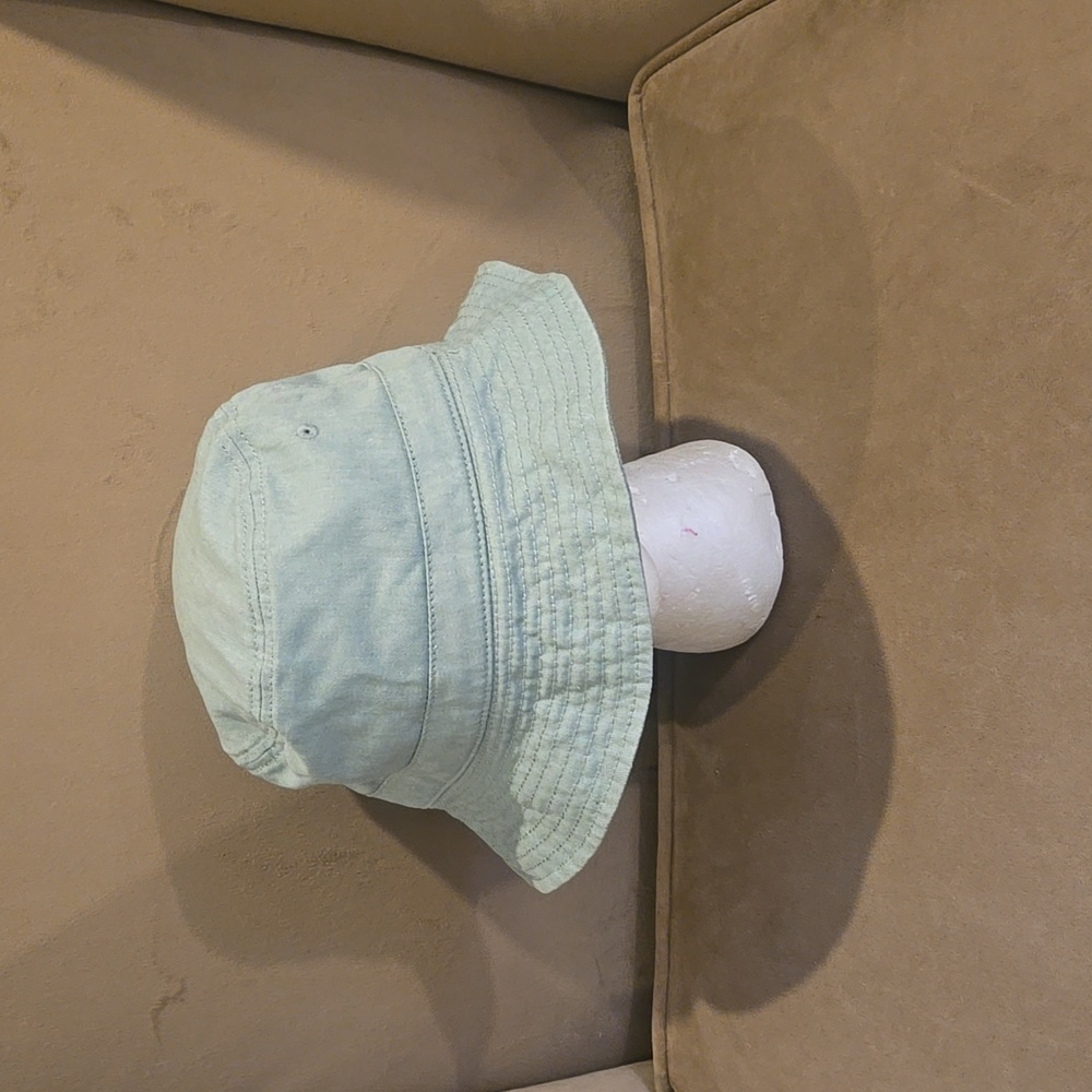 Light green bucket hat.
